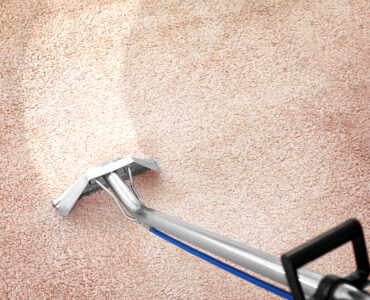 Removing,Dirt,From,Carpet,With,Professional,Vacuum,Cleaner,Indoors