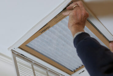 Man,Replacing,Dirty,Hvac,Air,Filter,In,Ceiling,Vent.,Home